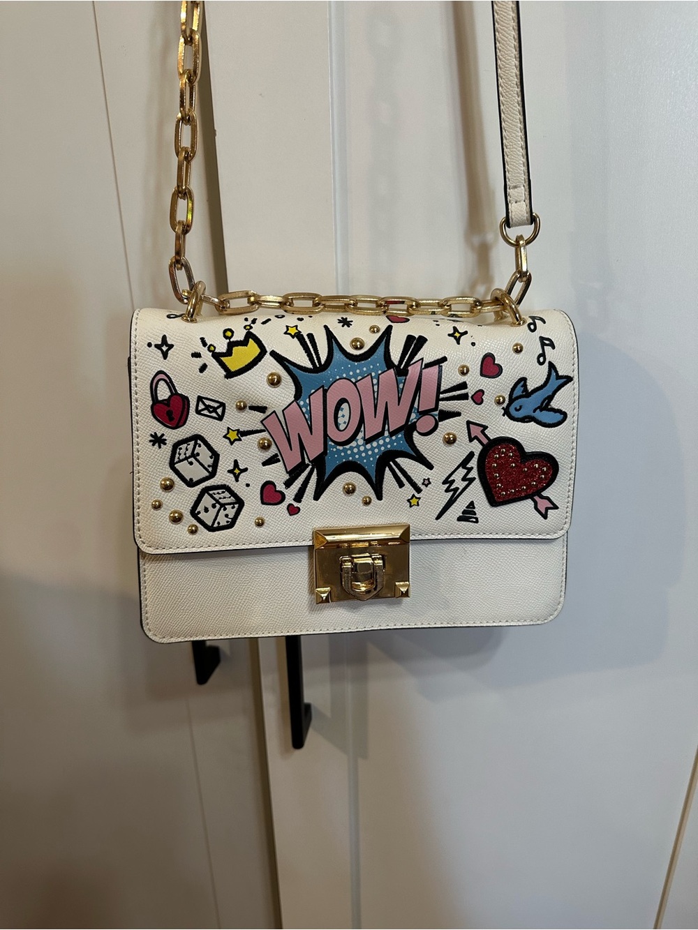 ALDO "WOW" novelty crossbody bag in white featuring pop art graphics